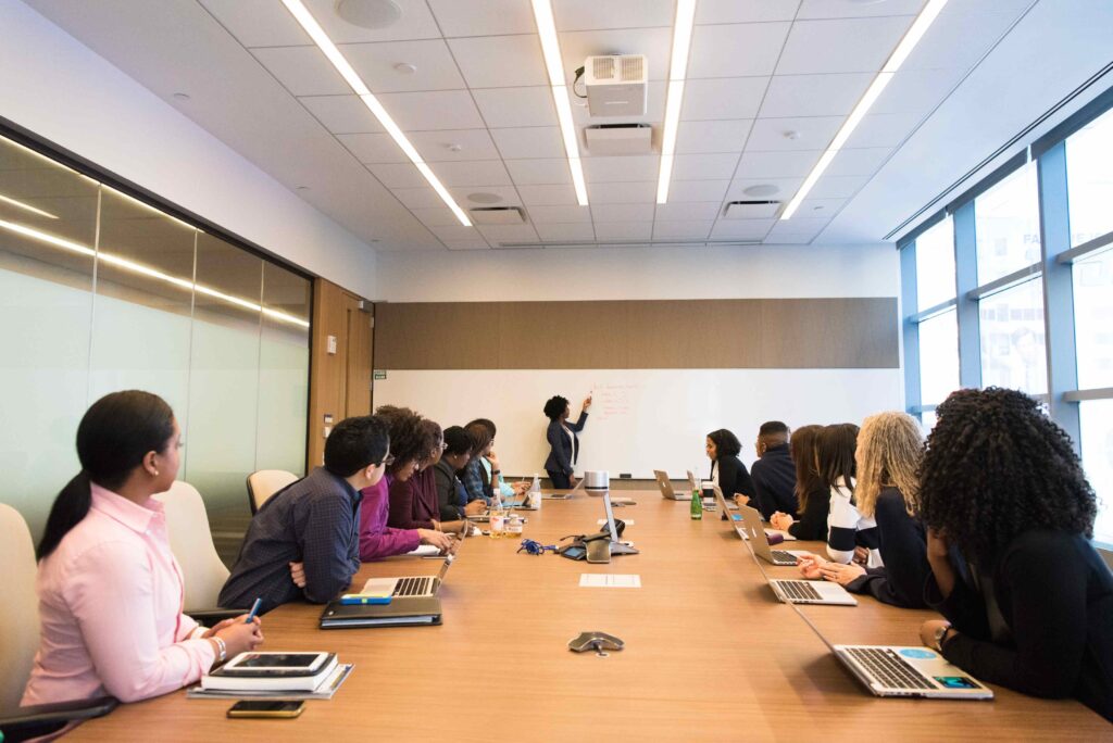 A diverse business team discussing projects during a meeting in a modern conference room