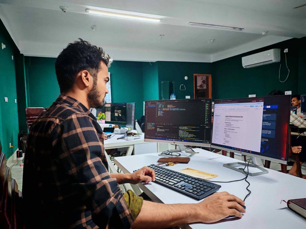 software engineer jobs in the UK - developer working on code in a modern office