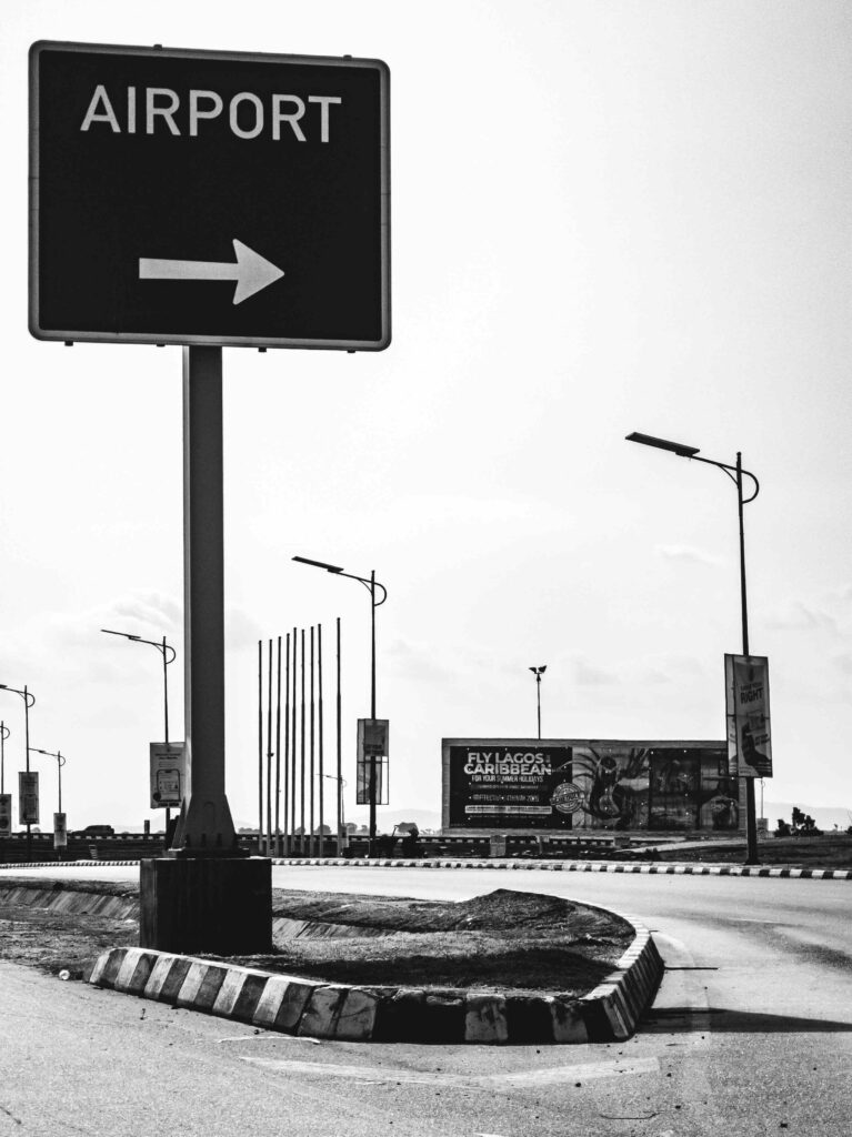 Black and white airport sign in Abuja, Nigeria