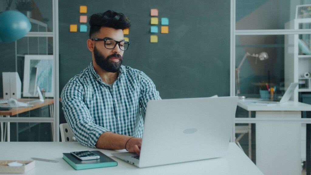 Office administrator jobs in Etobicoke ON - professional working at office desk