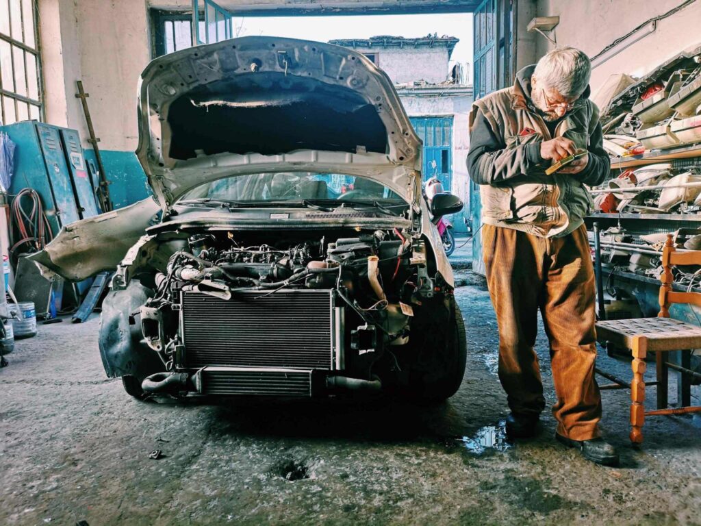 Automobile mechanic jobs in Laval QC - mechanic working on car engine in workshop